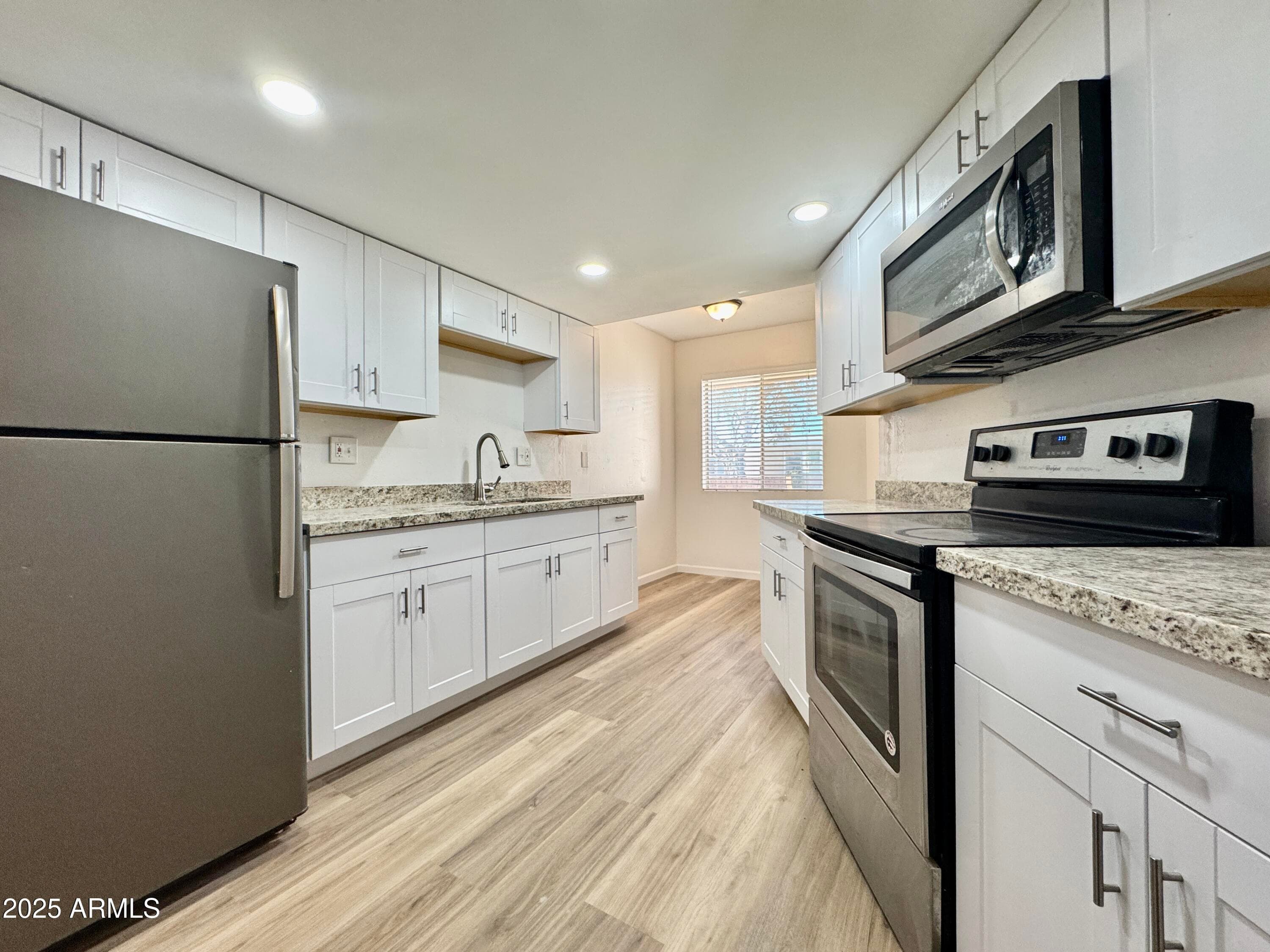 10949 W Coggins Dr — photo 1