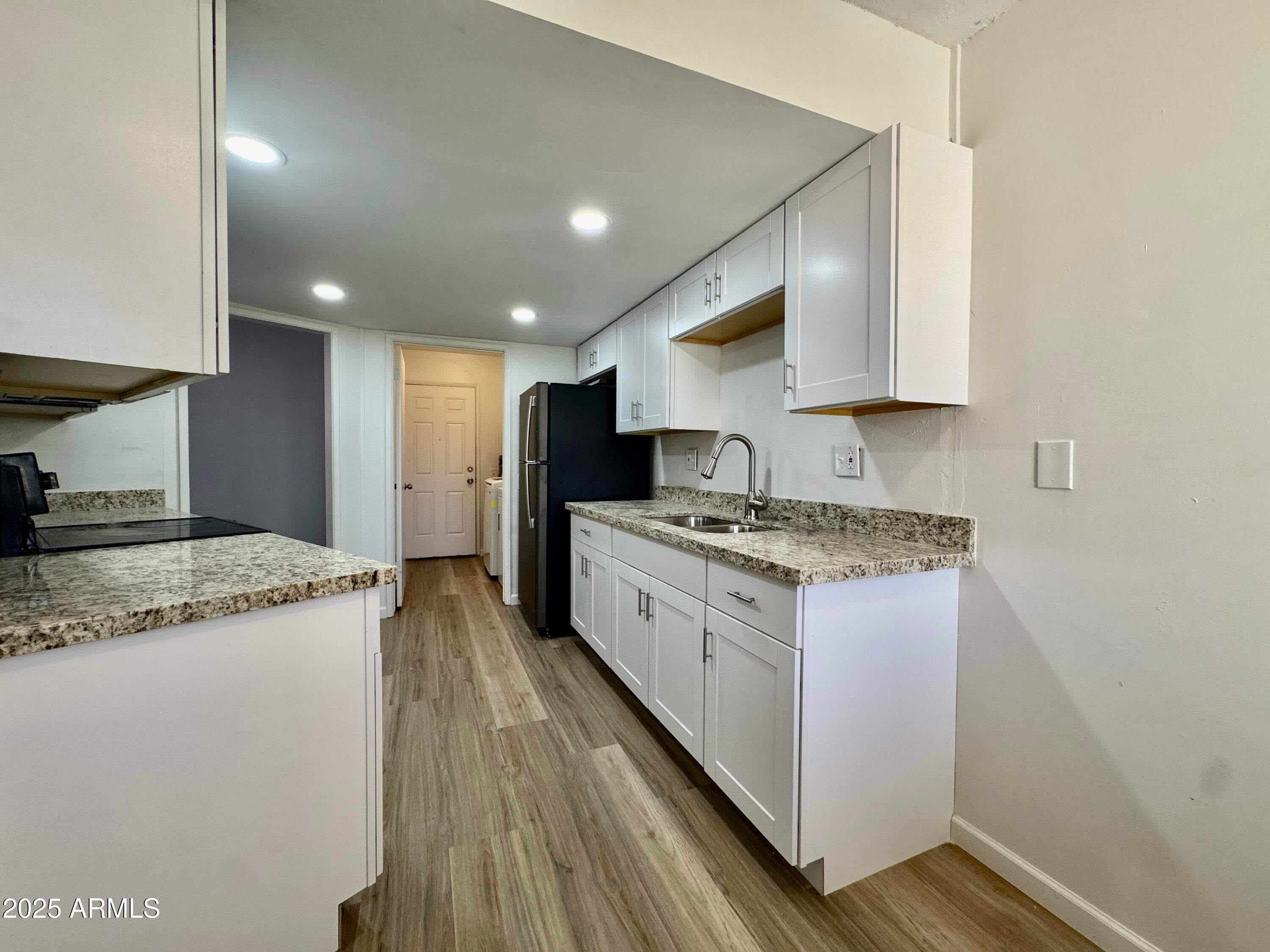 10949 W Coggins Dr — photo 2