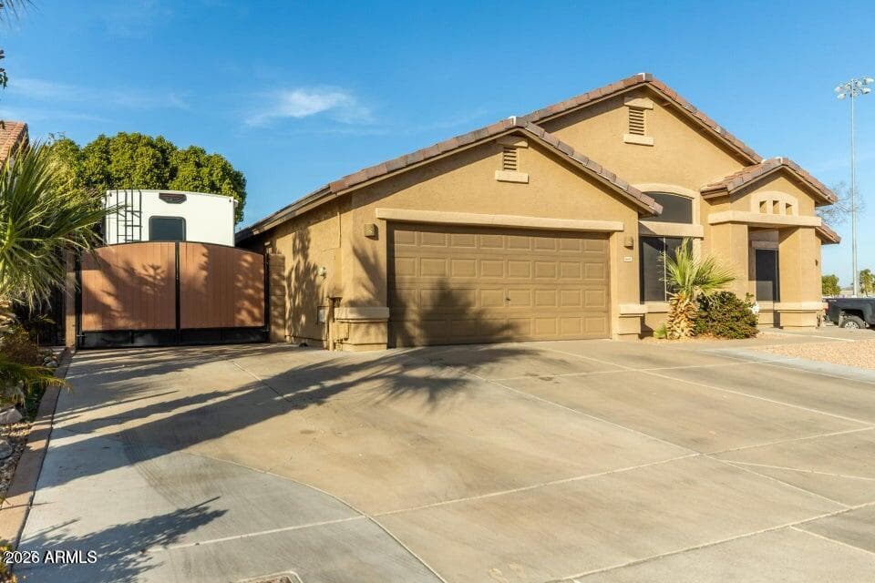 8642 W Harmony Ln — photo 2