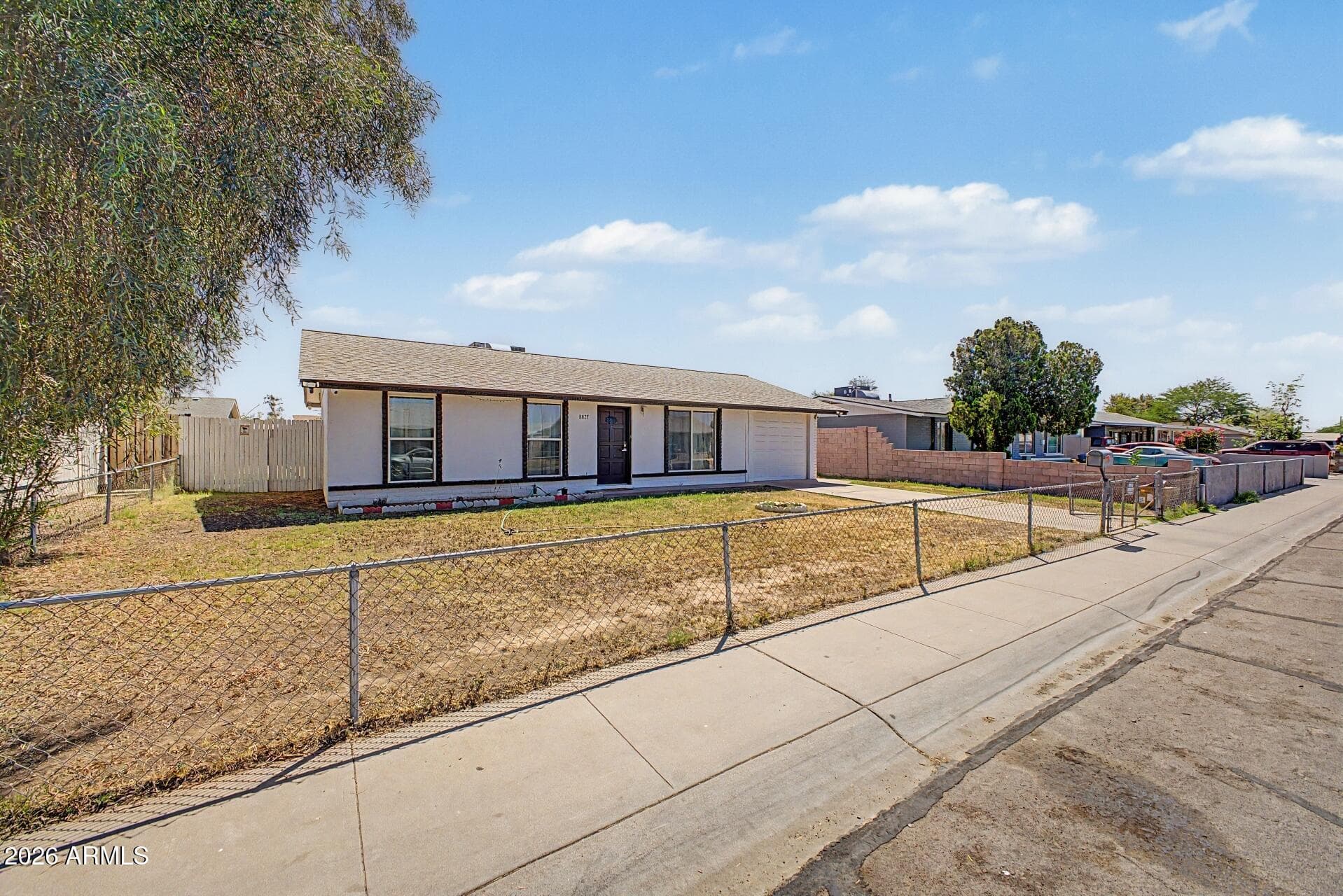 8827 W Heatherbrae Dr — photo 2