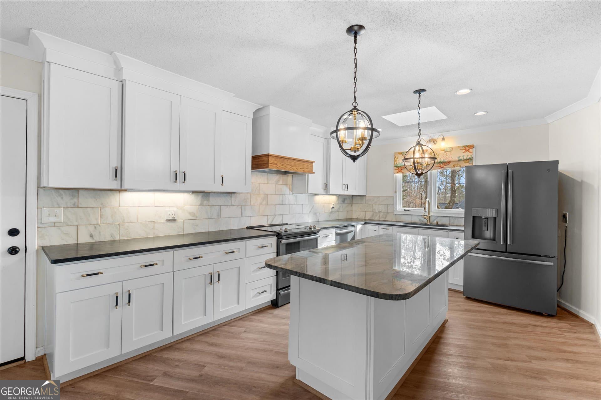 7349 S Mitchell Ct — photo 1