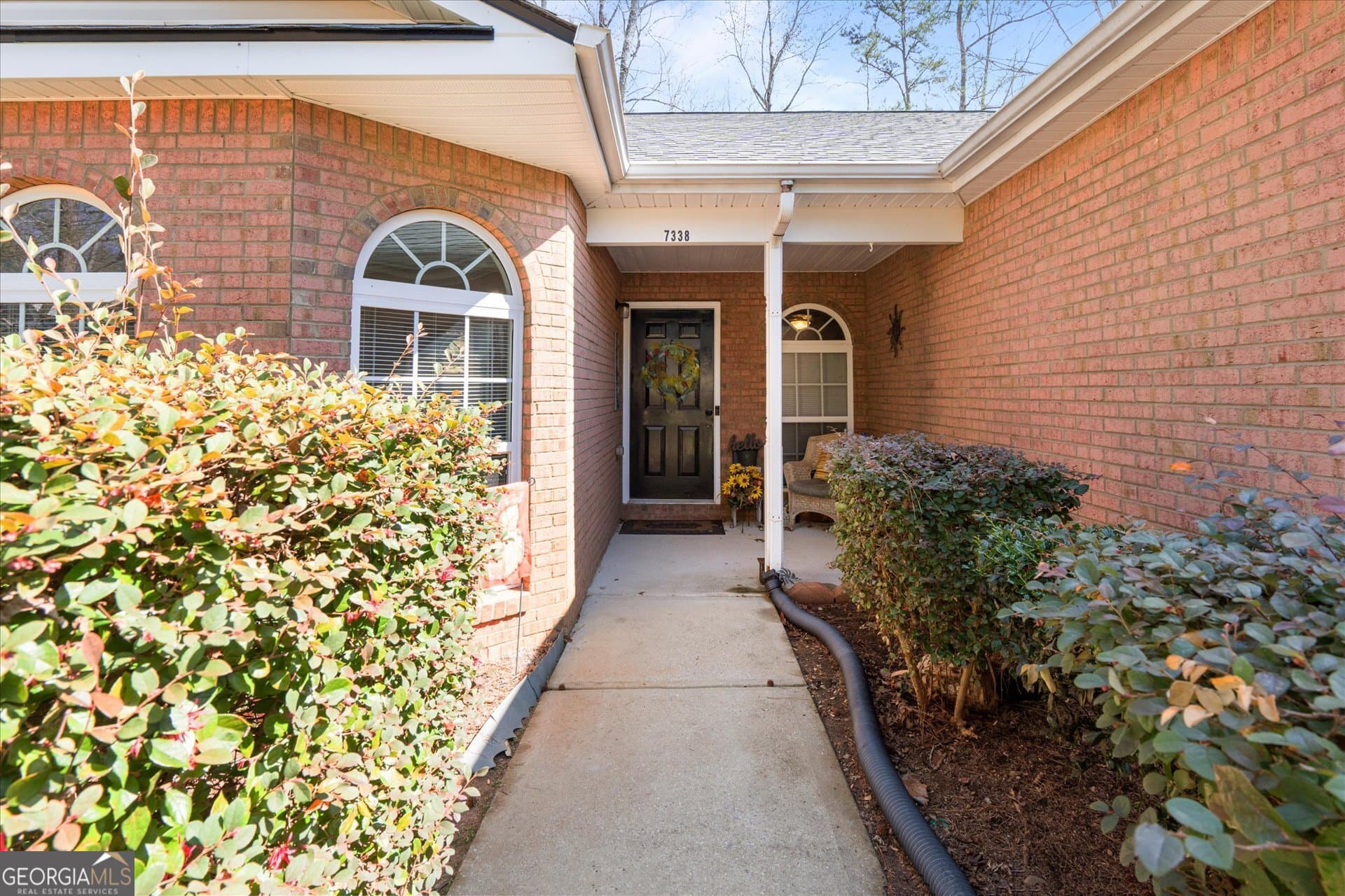 7338 S Mitchell Ct — photo 2